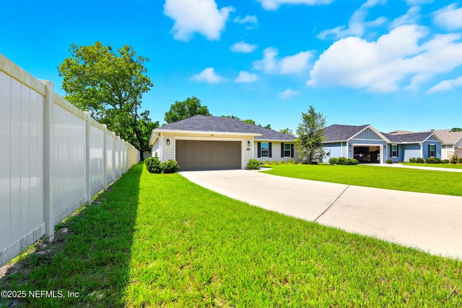 Front exterior of a new home in , Jacksonville, FL, highlighting curb appeal (Image 1).