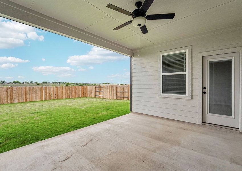 Covered rear patio featuring a ceiling fan and a view of the privacy-fenced backyard. Covered rear patio featuring a ceiling fan and a view of the privacy-fenced backyard.