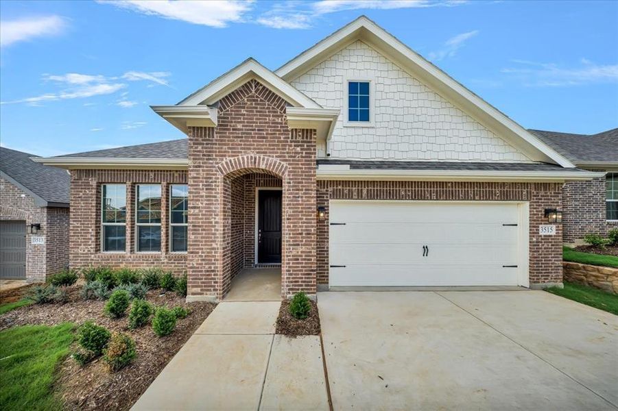 Front exterior of a new home in Liberty Pointe, Gainesville, TX, highlighting curb appeal (Image 21). Front exterior of a new home in Liberty Pointe, Gainesville, TX, highlighting curb appeal (Image 21).
