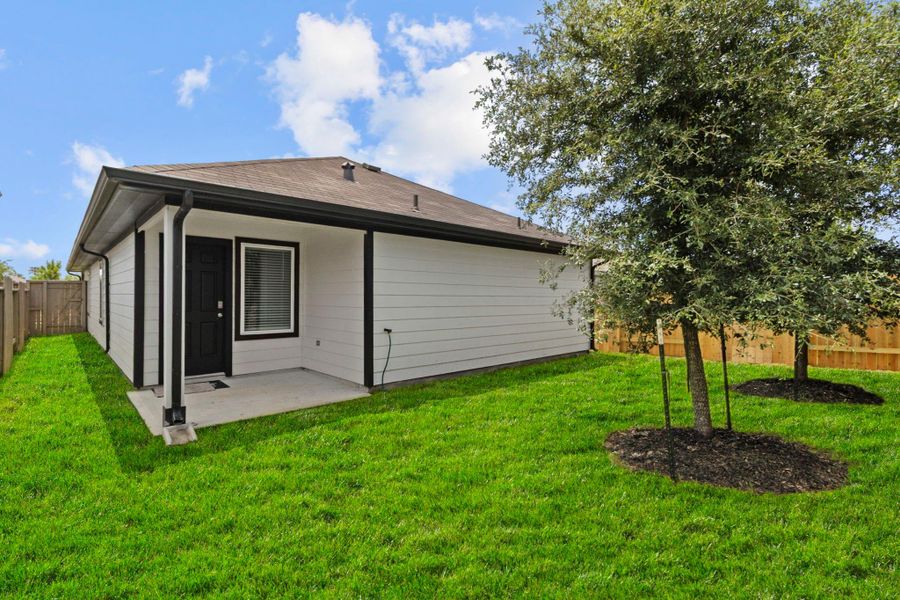 Exterior details and patio area of a home in Presswoods, Splendora (Image 3).