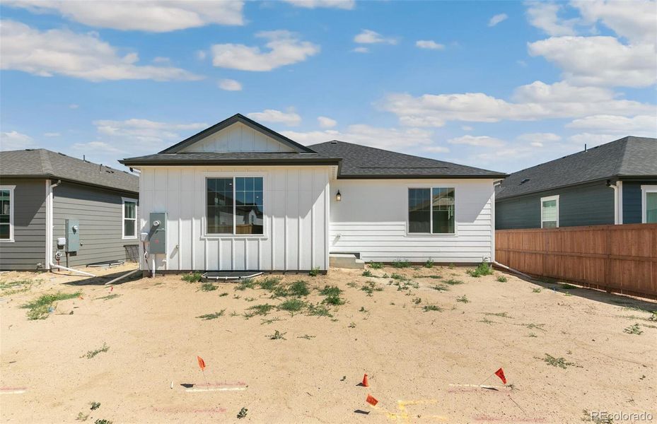 Front exterior of a new home in Farmlore, Brighton, CO, highlighting curb appeal (Image 18).