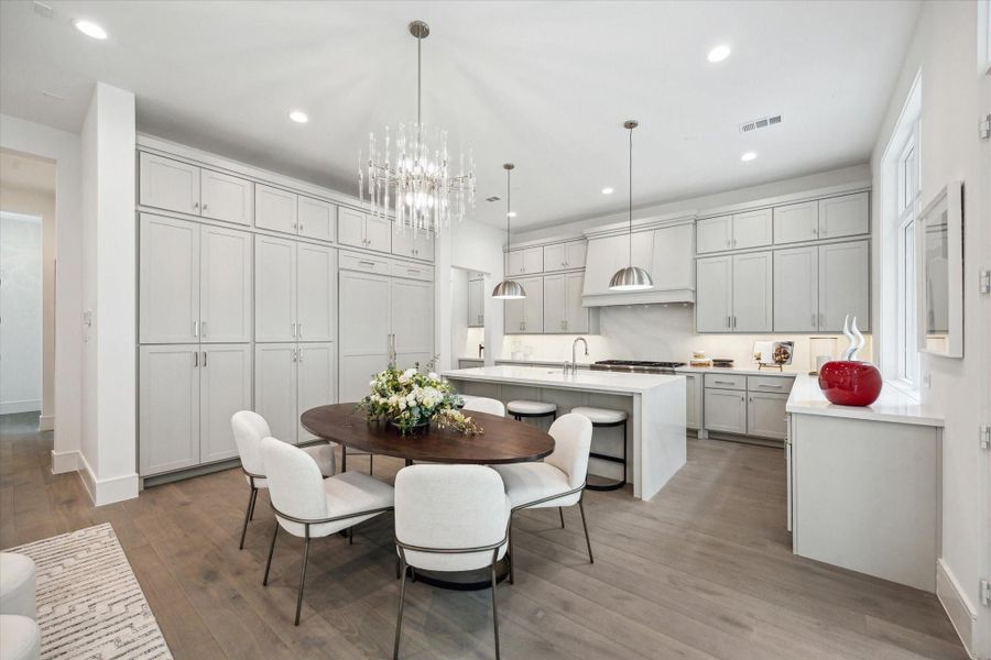 Dining space is located directly off of the living. Ample windows and a set of french doors fill this space with light. Dining space is located directly off of the living. Ample windows and a set of french doors fill this space with light.