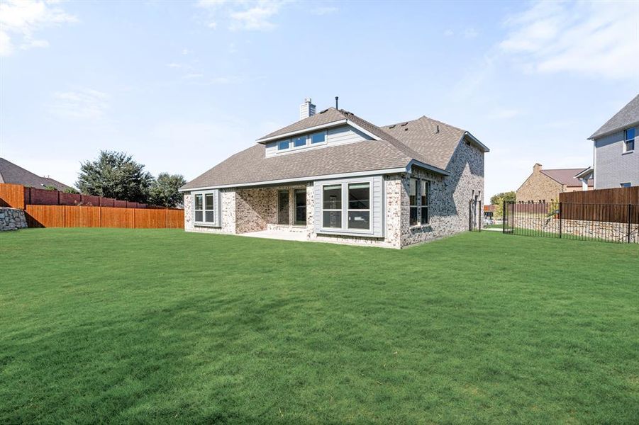 Exterior details and patio area of a home in The Enclave at Parks of Aledo, Aledo (Image 3). Exterior details and patio area of a home in The Enclave at Parks of Aledo, Aledo (Image 3).