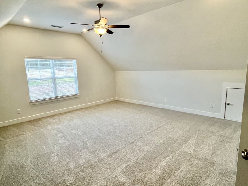 Large bonus room with a closet and a door for TV room, older child, guests....