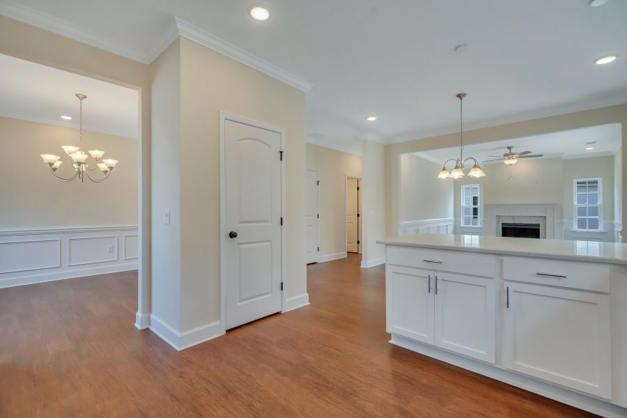 Looking into the Family & Dining Room from the Kitchen - Nantucket plan built by Ernest Homes - Customer selections Looking into the Family & Dining Room from the Kitchen - Nantucket plan built by Ernest Homes - Customer selections