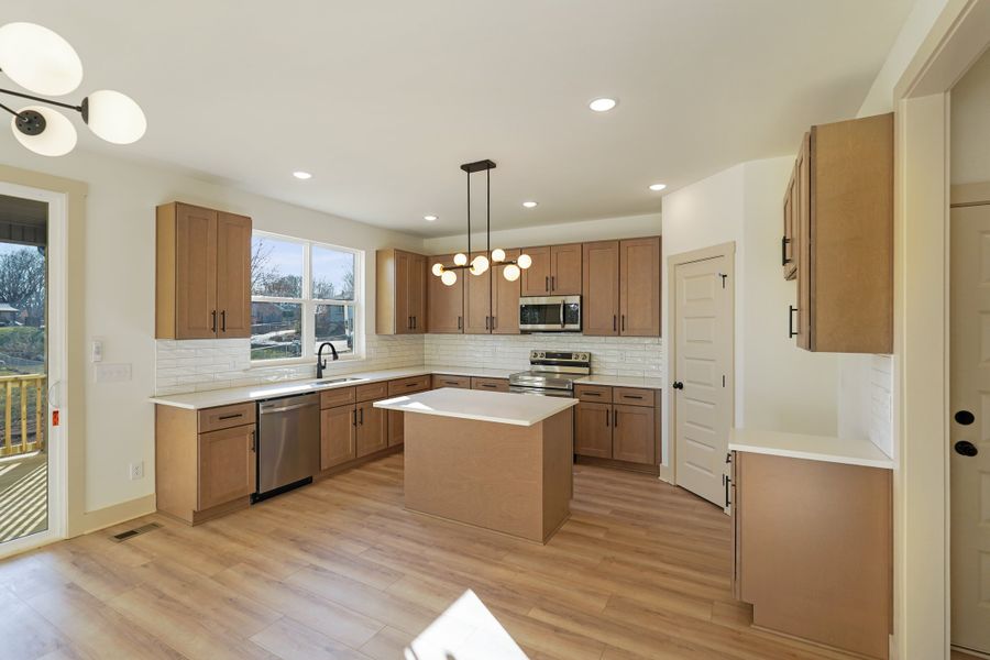 Representative furnished interior of a home built from the Two Story Farmhouse by Norfleet Builders in Cambria, White House (Image 6).