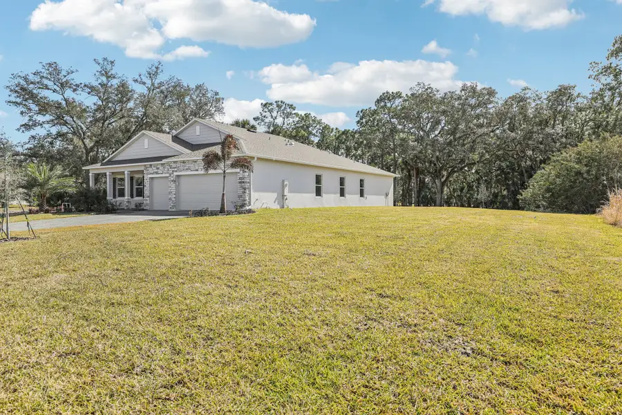 Exterior details and patio area of a home in Palm Bay, Palm Bay (Image 3).