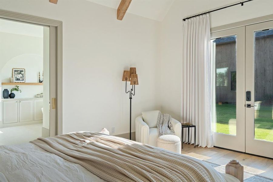 Bedroom with light wood-type flooring and french doors