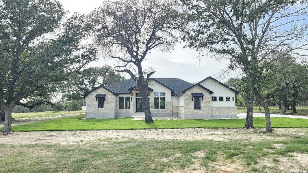 Front exterior of a new home in , Adkins, TX, highlighting curb appeal (Image 30). Front exterior of a new home in , Adkins, TX, highlighting curb appeal (Image 30).
