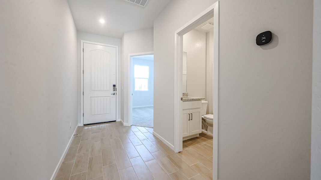 A bathroom with a wood floor. A bathroom with a wood floor.