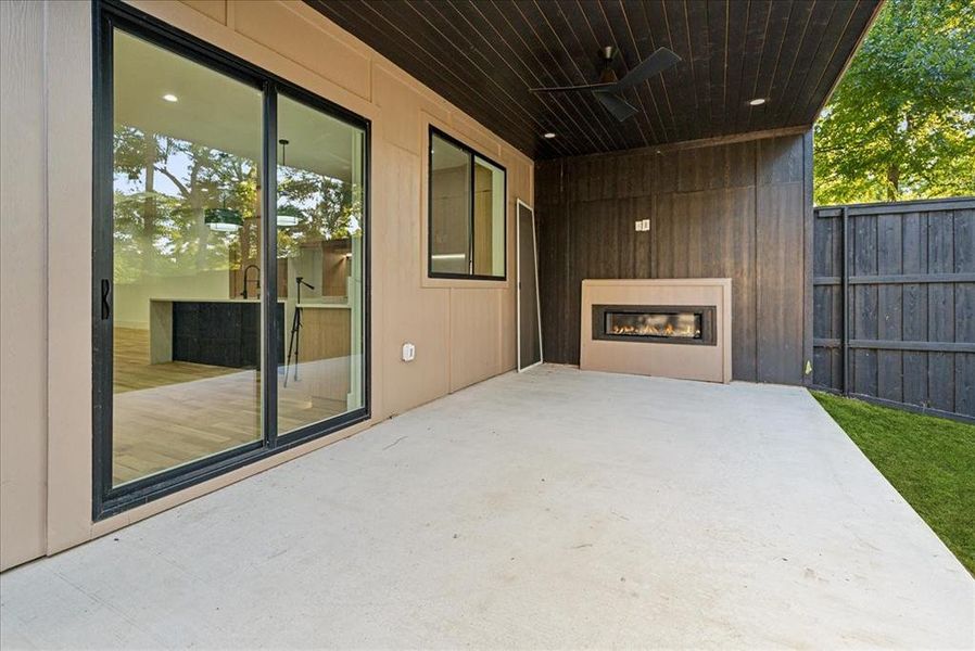 View of patio featuring ceiling fan