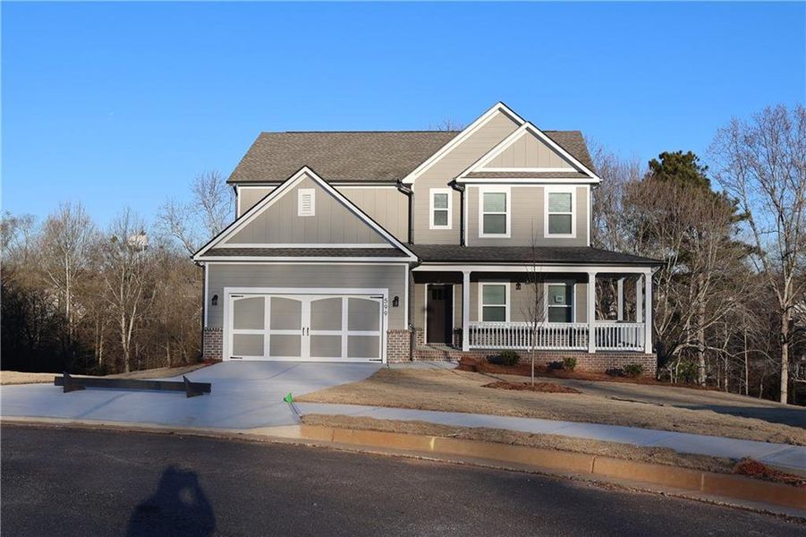 Front exterior of a new home in Calgary Downs, Winder, GA, highlighting curb appeal (Image 1).