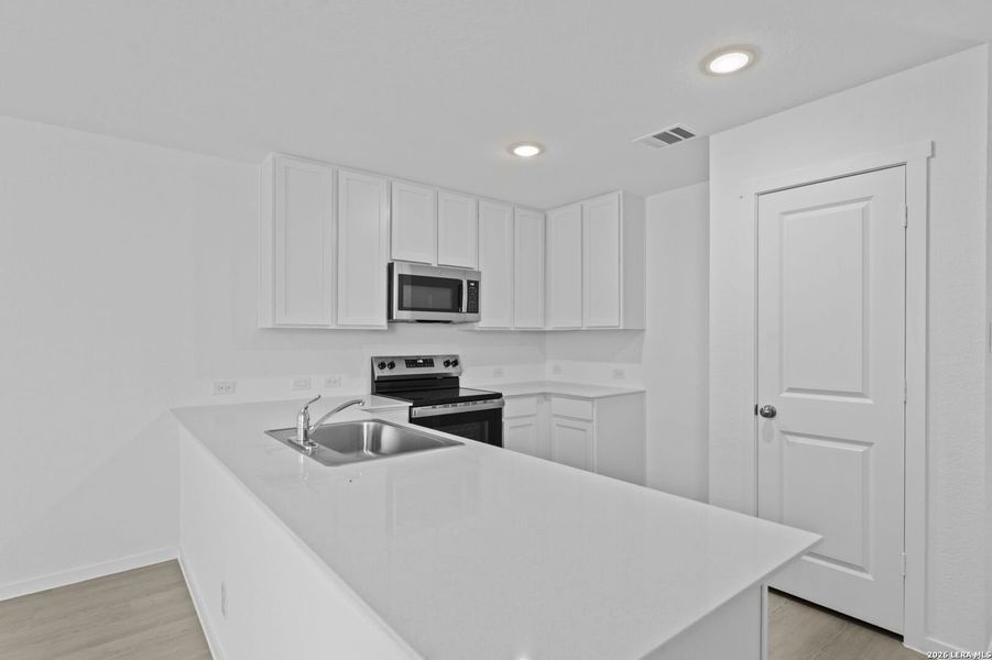 Furnished interior view inside a new home in Guadalupe Ridge, New Braunfels (Image 8).