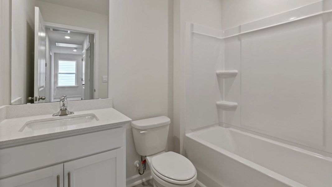 Furnished interior view inside a new home in The Grove at Matthews Landing, Fuquay Varina (Image 7).