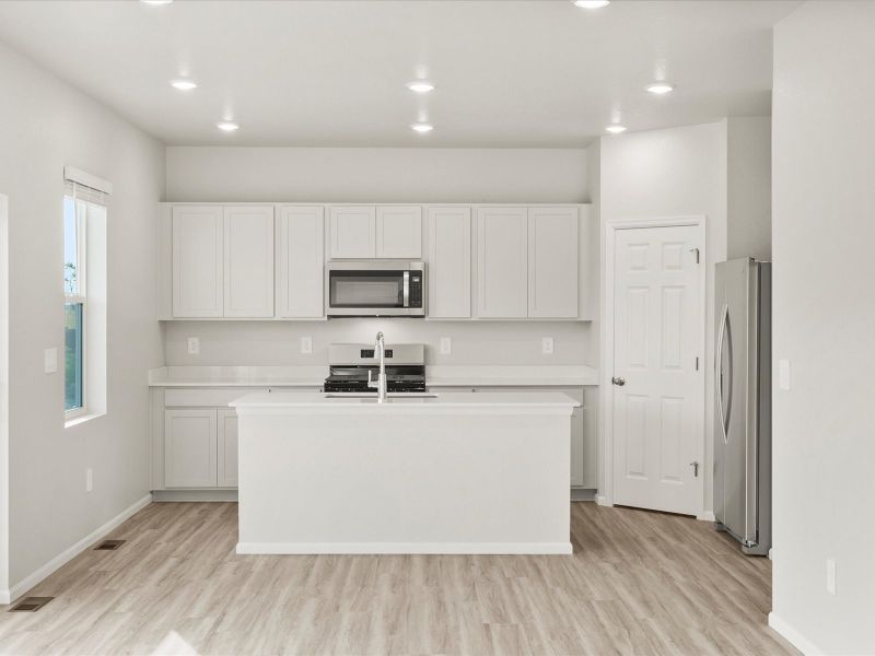 Front exterior of a new home in Westgate, Greeley, CO, highlighting curb appeal (Image 2). Front exterior of a new home in Westgate, Greeley, CO, highlighting curb appeal (Image 2).