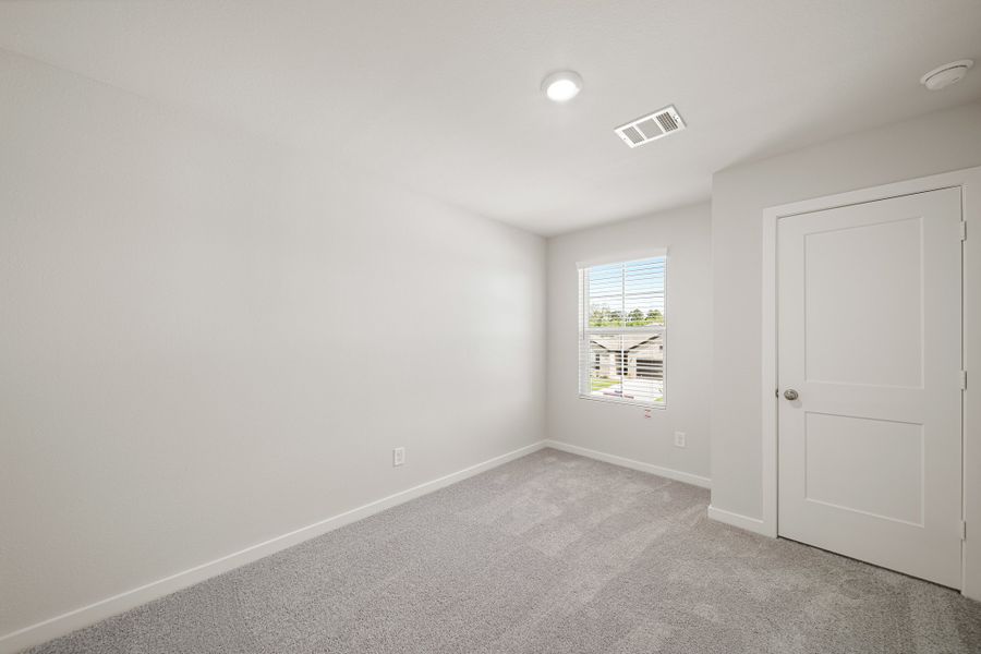 A room with a door and a window. A room with a door and a window.