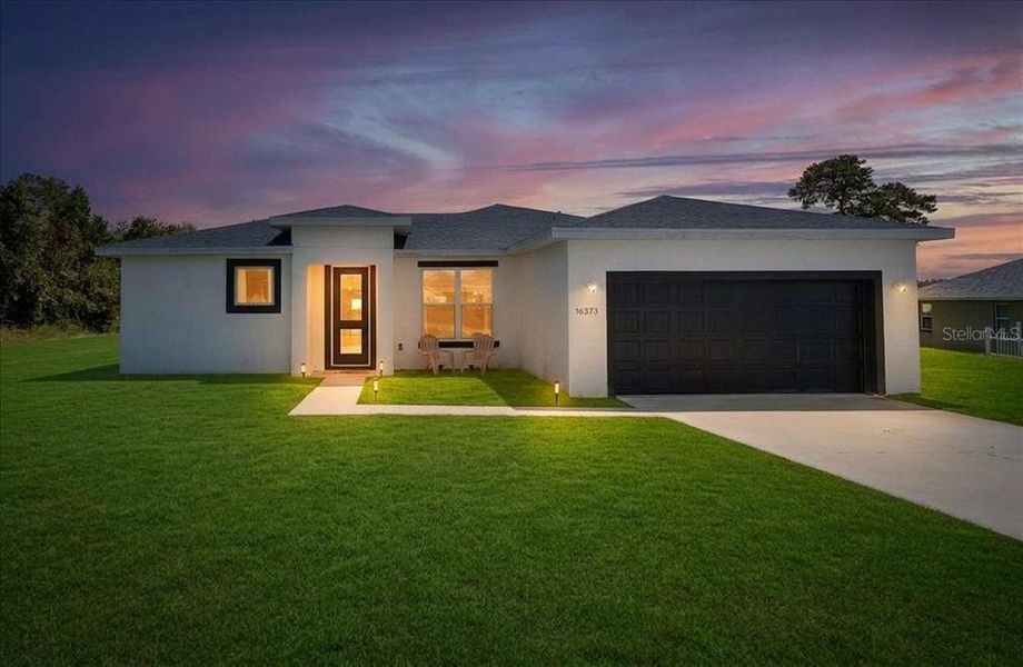 Front exterior of a new home in , Ocala, FL, highlighting curb appeal (Image 27).