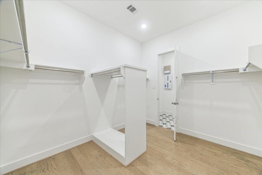 There is a huge closet in the Primary Suite that leads directly to the Laundry for easy access. There is a huge closet in the Primary Suite that leads directly to the Laundry for easy access.