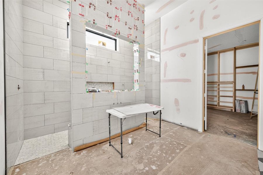 Primary closet accessible through the primary bath