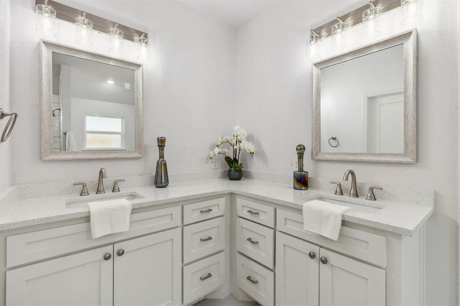 Bathroom featuring double vanity