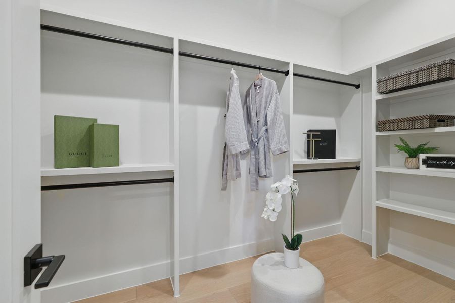 Spacious closet with wood finished floors