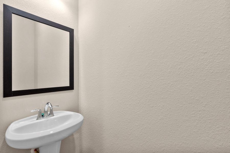 This charming home features a beautifully appointed half bath adjacent to the family room, perfect for welcoming guests and adding convenience to your daily life. This charming home features a beautifully appointed half bath adjacent to the family room, perfect for welcoming guests and adding convenience to your daily life.