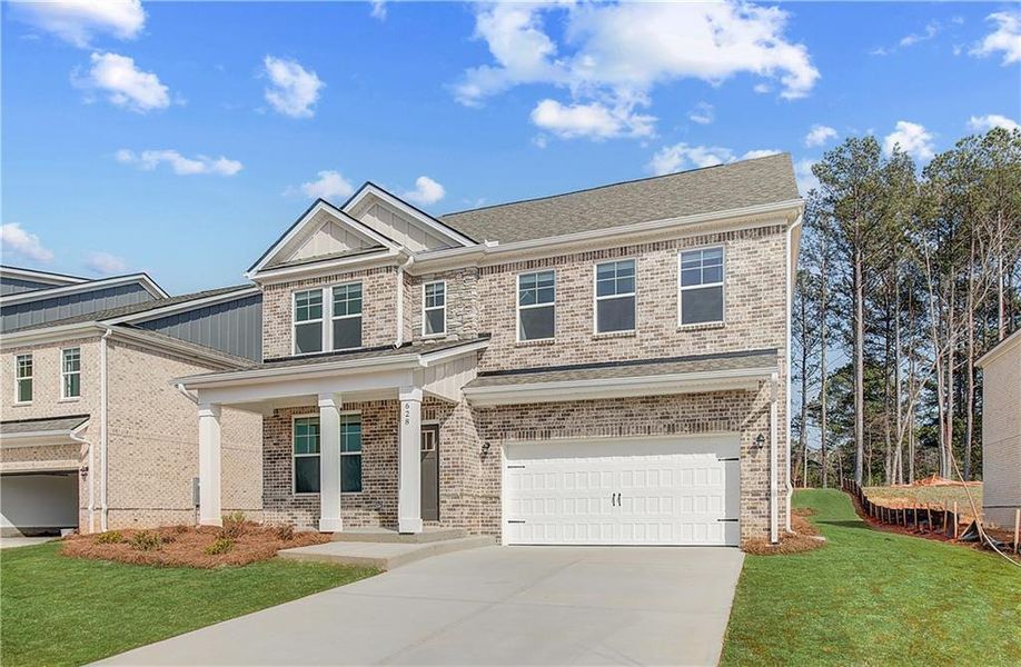 Front exterior of a new home in Bowers Farm, McDonough, GA, highlighting curb appeal (Image 2). Front exterior of a new home in Bowers Farm, McDonough, GA, highlighting curb appeal (Image 2).