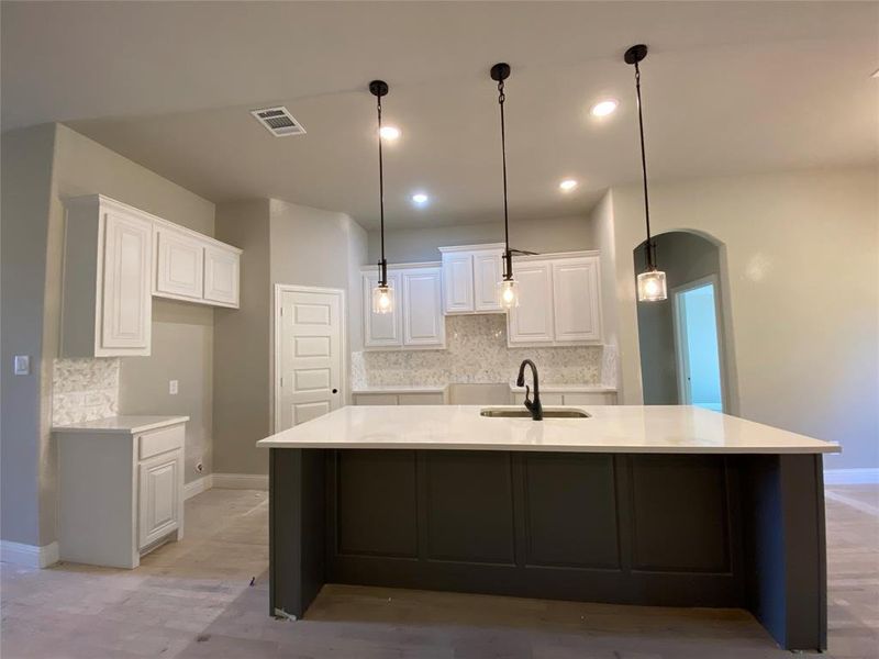 Kitchen island is highlighted by ORB pendant lights as a focal point (hardwoods not stained Aged Barrel Grey w/Black tint yet) Kitchen island is highlighted by ORB pendant lights as a focal point (hardwoods not stained Aged Barrel Grey w/Black tint yet)