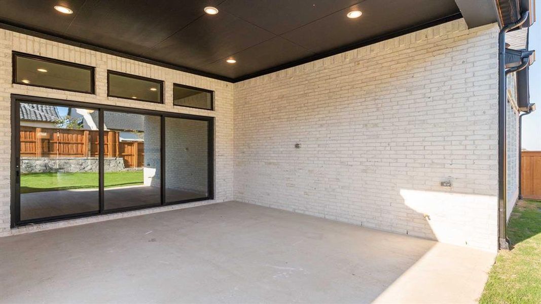 Exterior details and patio area of a home in Fields 60', Frisco (Image 3).