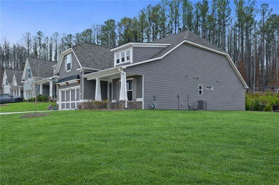 Exterior details and patio area of a home in Stratford at NatureWalk, Dallas (Image 4).