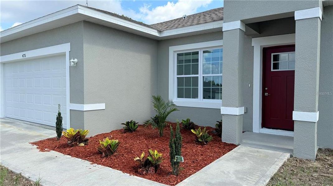 Front exterior of a new home in , Ocala, FL, highlighting curb appeal (Image 2).