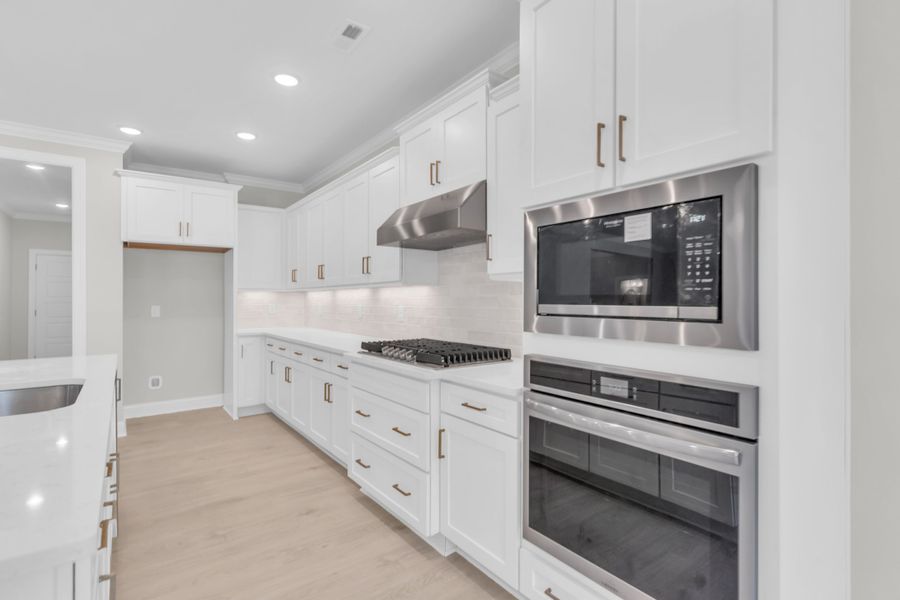 Representative furnished interior of a home built from the The Bradley by RobuckHomes in Windwater, Hampstead (Image 59).