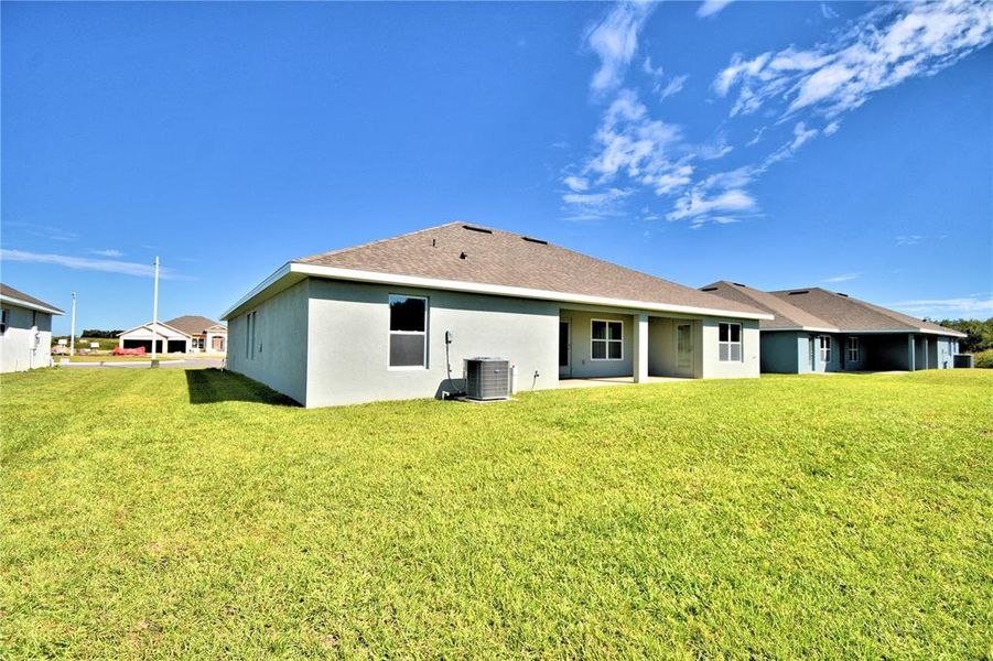 Exterior details and patio area of a home in Cadence Crossing, Auburndale (Image 23).