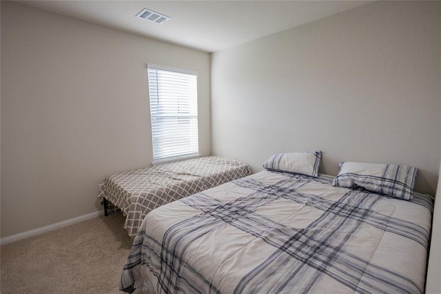 Three additional bedrooms, each well-proportioned with good natural light and closet space. Perfect for family, guests, or home office needs.