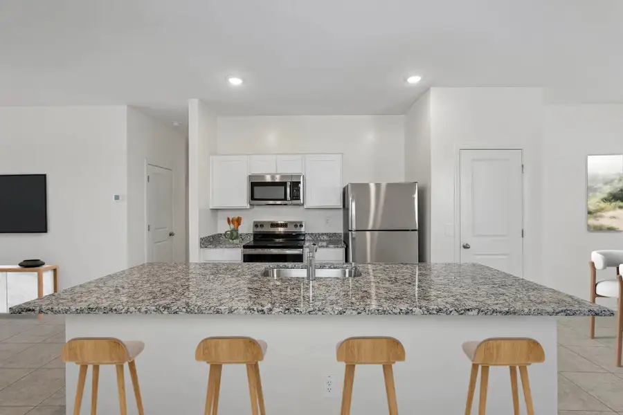 Representative furnished interior of a home built from the Sterling by Starlight Homes in Agave Trails, Buckeye (Image 5).