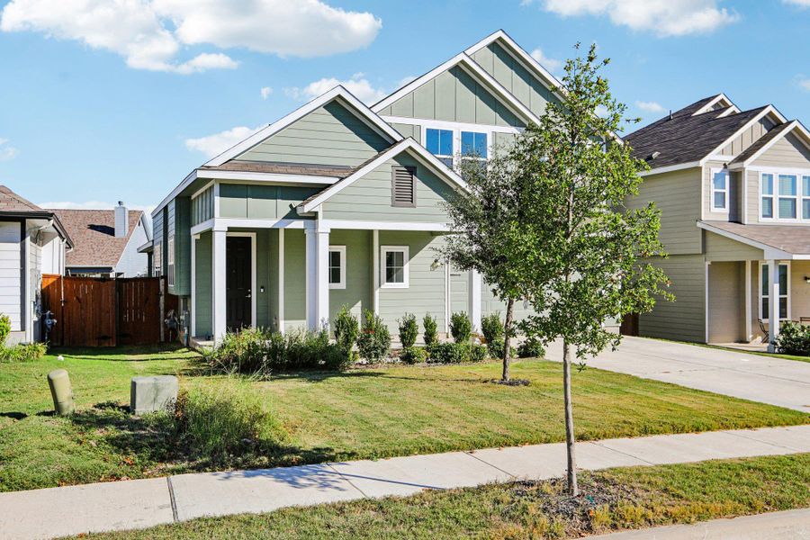 Front exterior of a new home in Orchard Ridge, Liberty Hill, TX, highlighting curb appeal (Image 17).