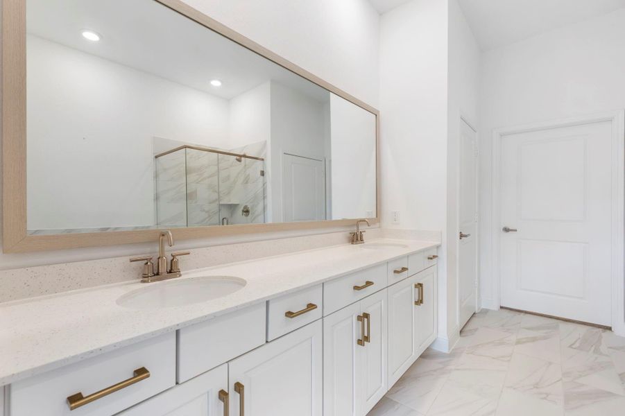 The primary bathroom is equipped with dual sinks