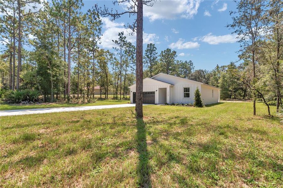 Front exterior of a new home in , Ocala, FL, highlighting curb appeal (Image 27).
