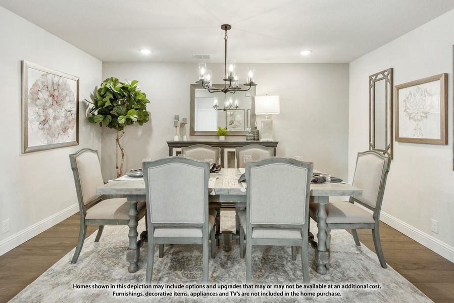 Dining room with six-chair wooden table, chandelier, and hardwood floors Dining room with six-chair wooden table, chandelier, and hardwood floors