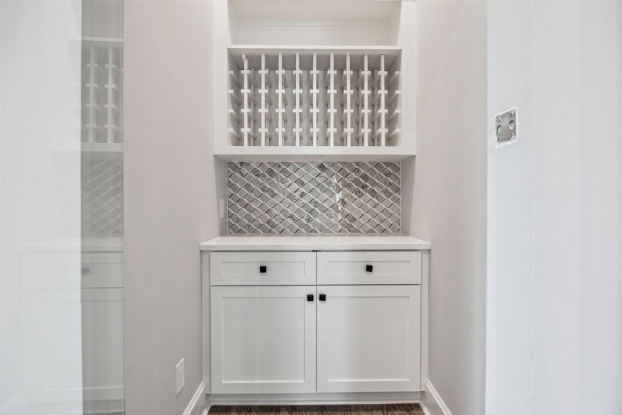 Service pantry with fitted storage adjacent in addition o a fitted walk-in pantry Service pantry with fitted storage adjacent in addition o a fitted walk-in pantry