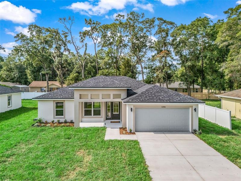 Front exterior of a new home in , Ocala, FL, highlighting curb appeal (Image 23).
