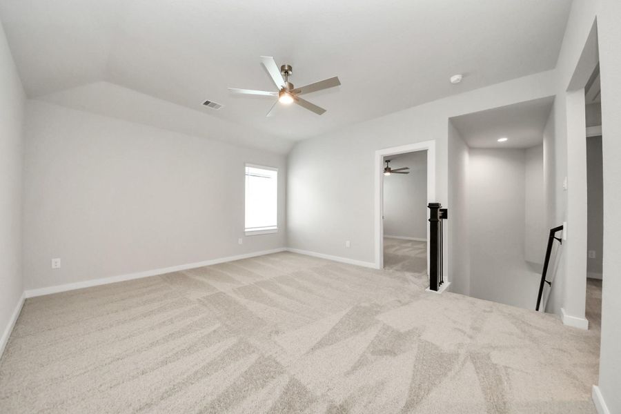 Come upstairs and enjoy a day of leisure in this fabulous game room! This is the perfect hangout spot or adult game room! Features plush carpet, high ceilings, custom paint and windows for plenty of natural light.