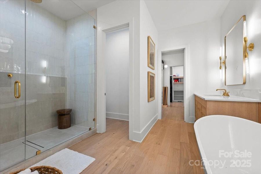 Walk in shower with glass surround and linear drain system. Walk in shower with glass surround and linear drain system.