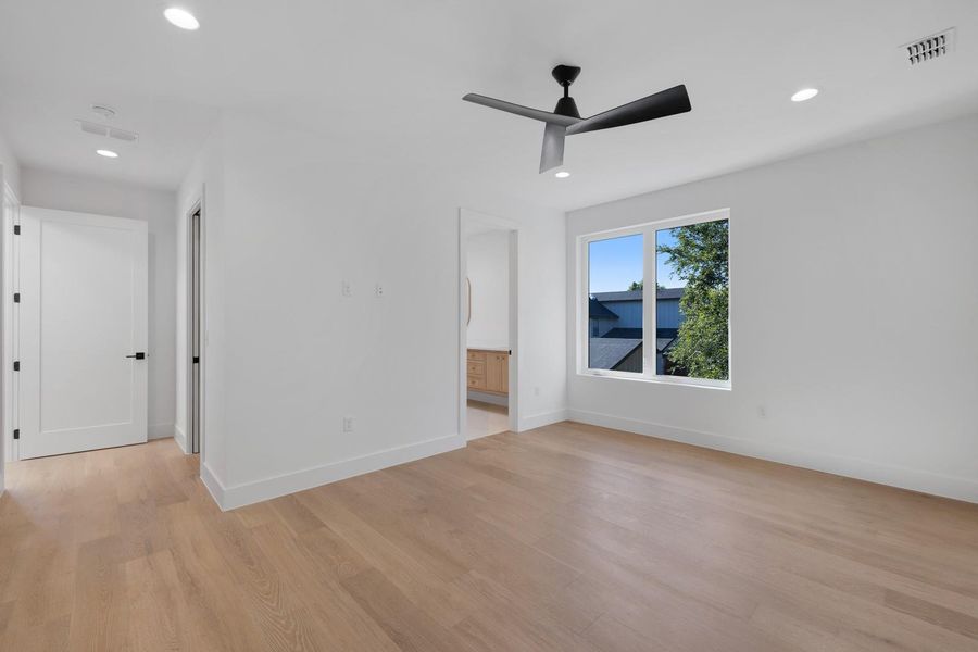 Spare room featuring recessed lighting, light wood-style flooring, and a ceiling fan Spare room featuring recessed lighting, light wood-style flooring, and a ceiling fan