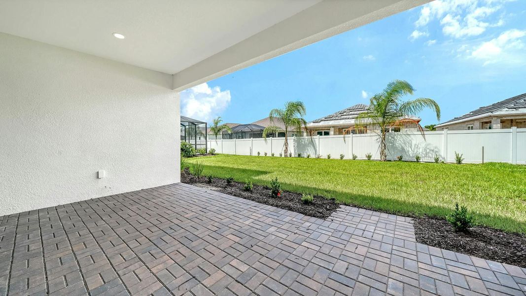 Exterior details and patio area of a home in Windward Real Estate and Homes for Sale in Sarasota, FL - Neal Communities, Lakewood Ranch (Image 30).