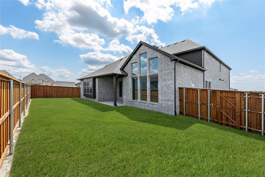 Front exterior of a new home in Nelson Lake, Rockwall, TX, highlighting curb appeal (Image 17). Front exterior of a new home in Nelson Lake, Rockwall, TX, highlighting curb appeal (Image 17).