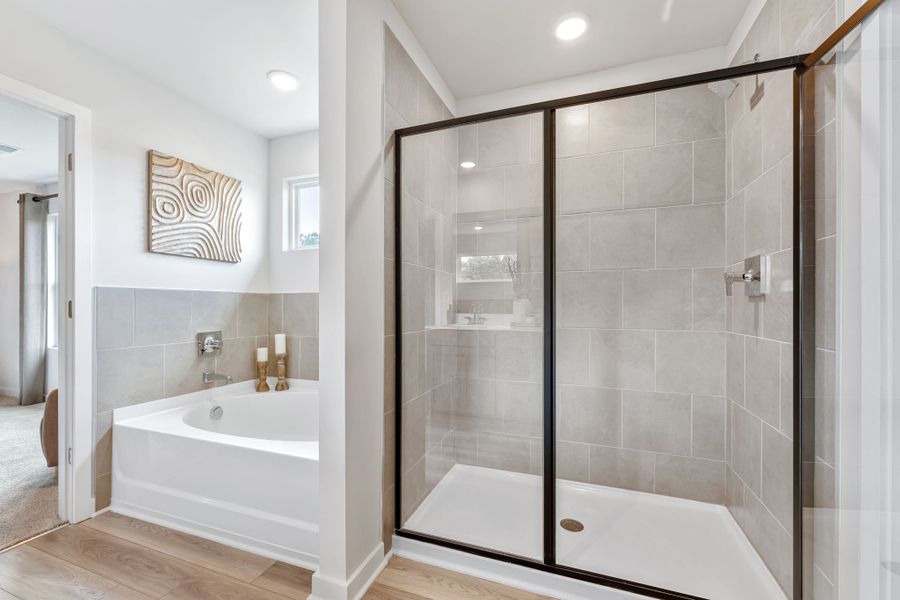 A bathroom with a glass shower. A bathroom with a glass shower.