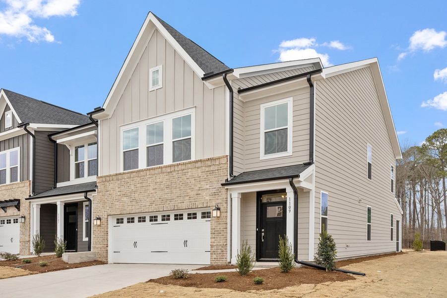 Front exterior of a new home in Ovation at Sweetbrier, Durham, NC, highlighting curb appeal (Image 2). Front exterior of a new home in Ovation at Sweetbrier, Durham, NC, highlighting curb appeal (Image 2).