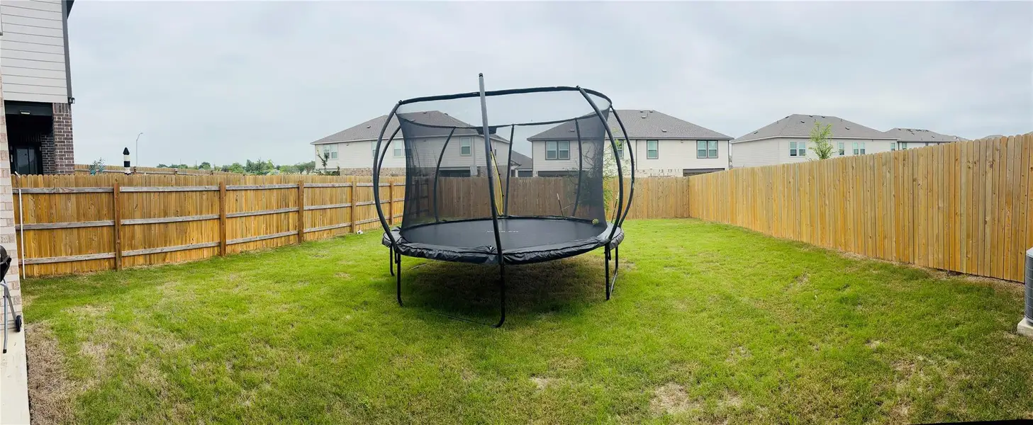 HUGE Backyard with wood privacy fence. HUGE Backyard with wood privacy fence.