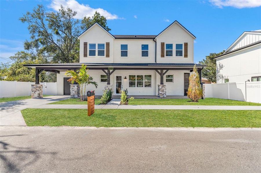 Front exterior of a new home in , Tampa, FL, highlighting curb appeal (Image 1). Front exterior of a new home in , Tampa, FL, highlighting curb appeal (Image 1).